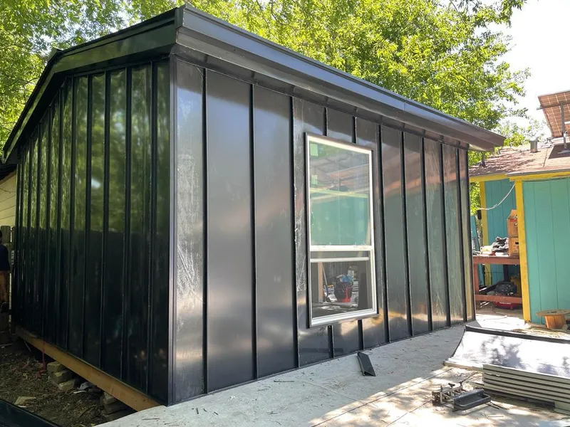 Black standing seam metal wall panels for Roof Inspection in Ann Arbor
